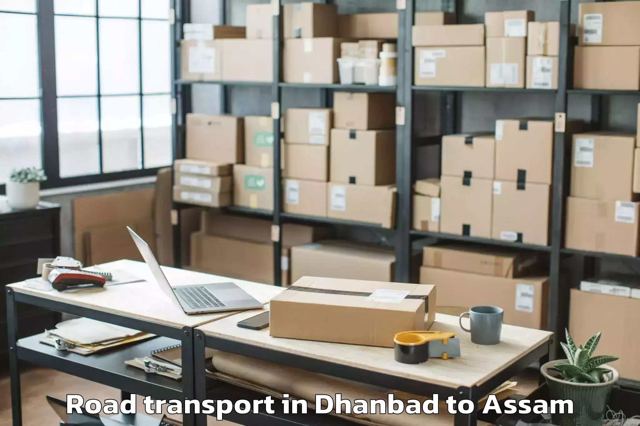 Book Dhanbad to Sualkuchi Road Transport